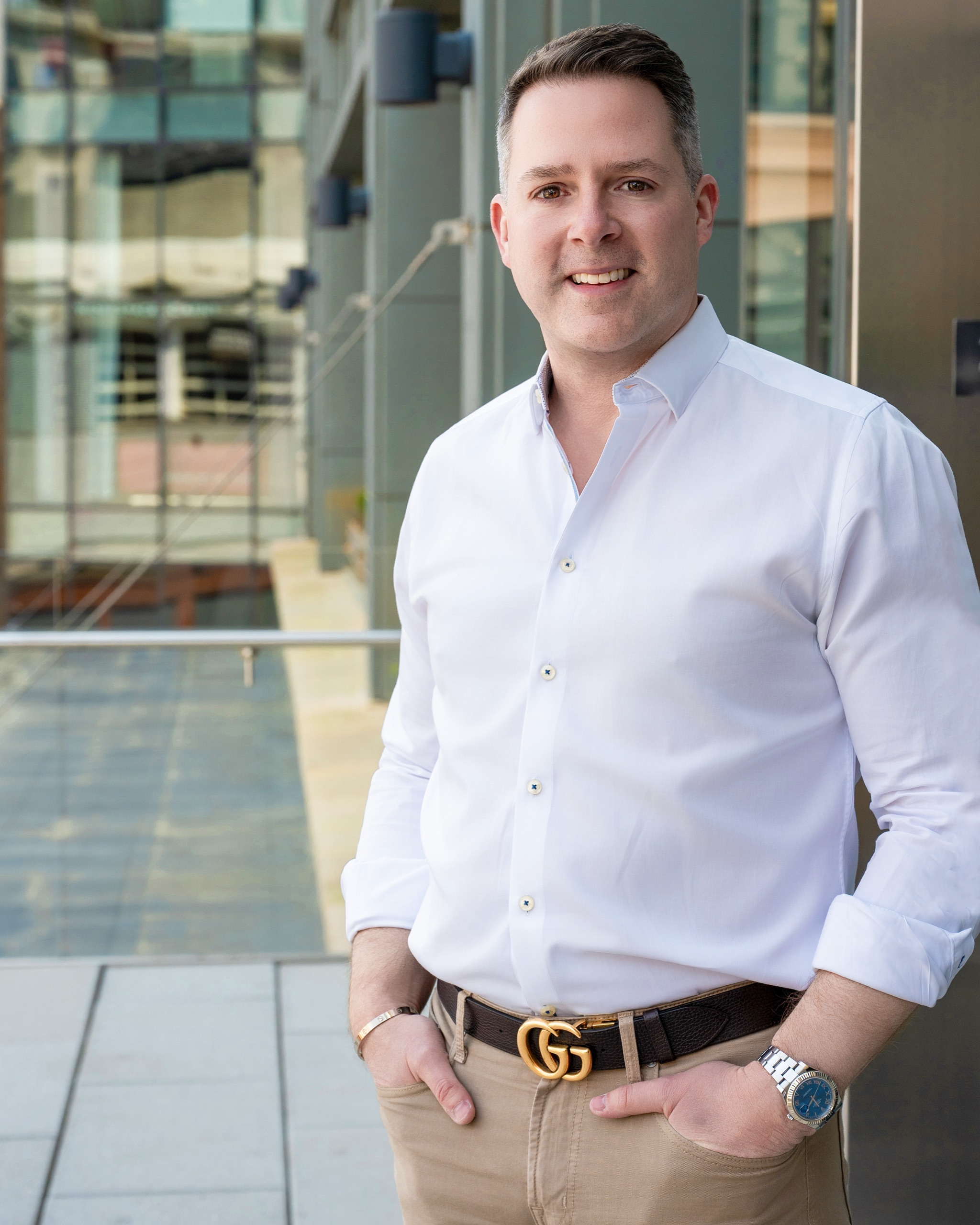 Brand portrait of an Atlanta professional in a white shirt downtown